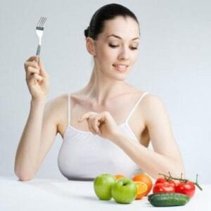 Woman with Fork and Fruits